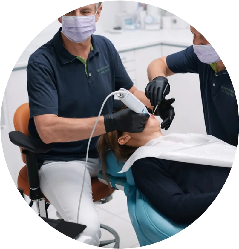 Dentist treating a patient in the dental chair at Harajda Dent, Sopron